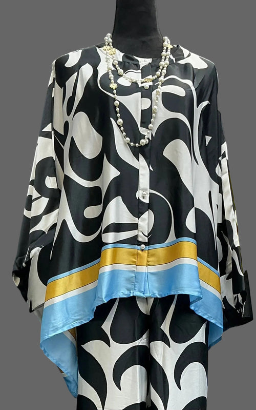 Black and white patterned top with blue and gold accents