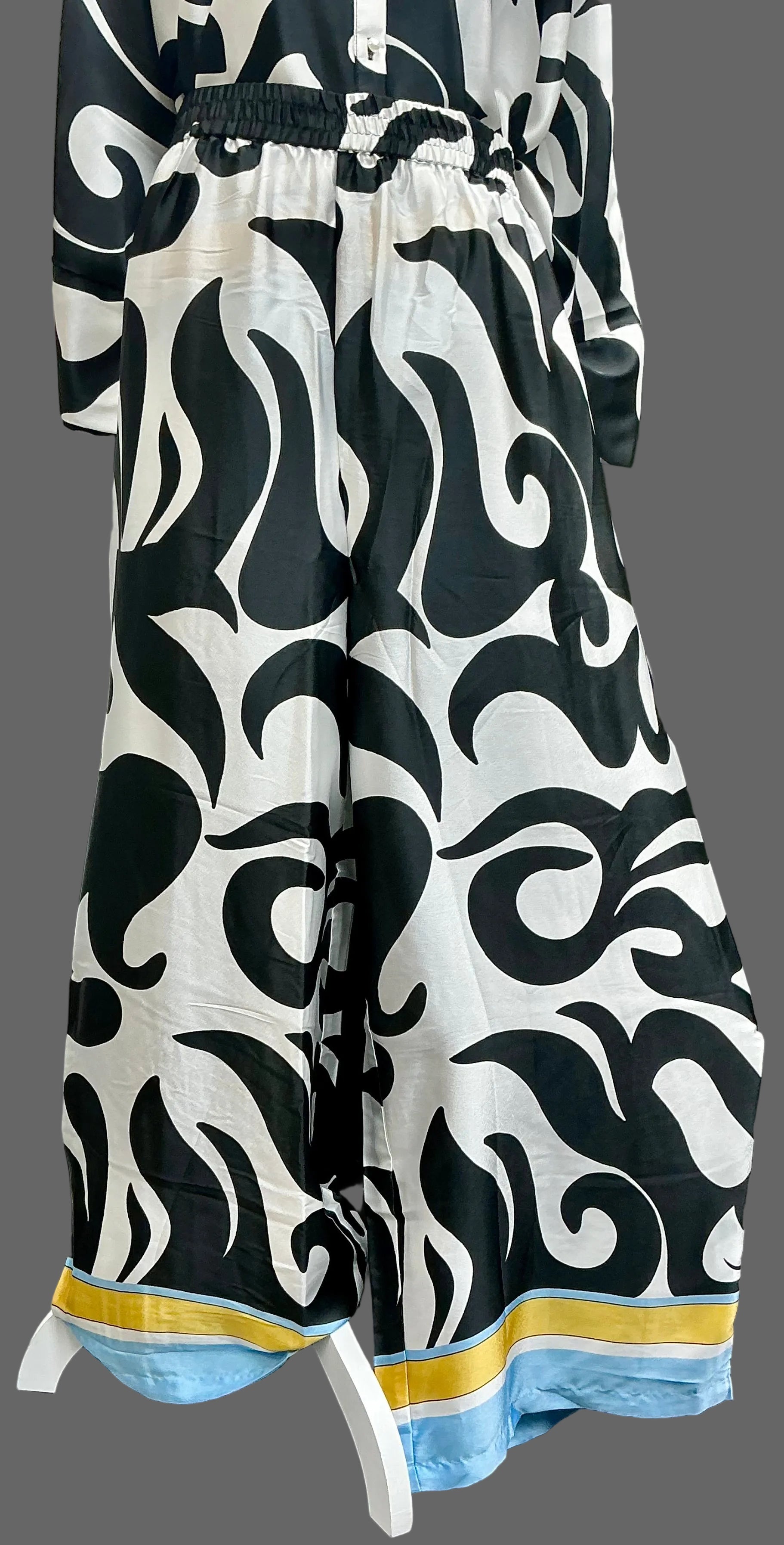 Black and white patterned dress with a yellow and blue accent
