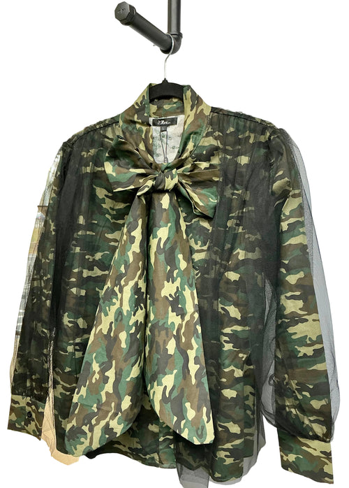 Camouflage shirt with black mesh overlay with a large bow on a hanger against a white background