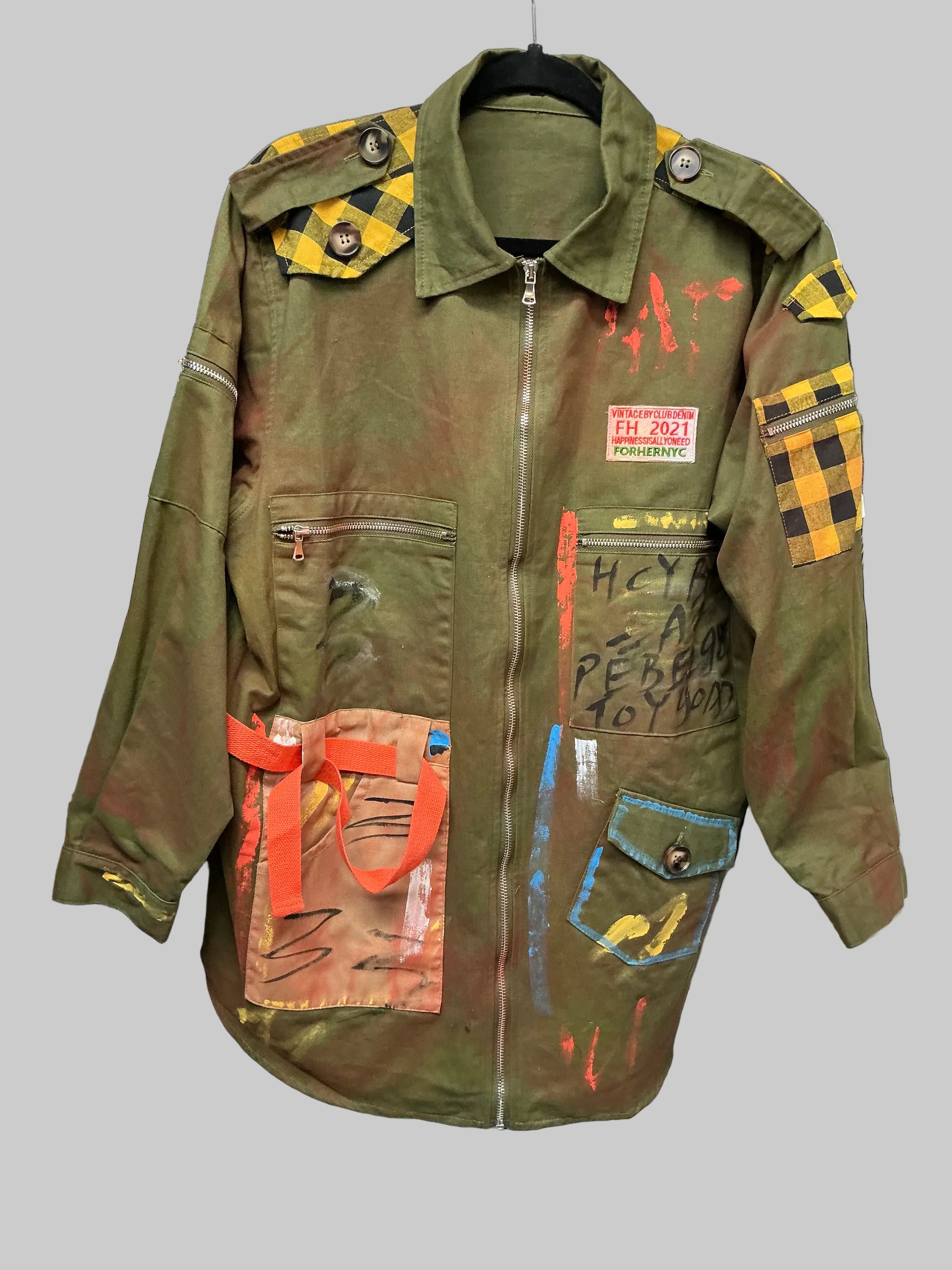 Olive green jacket with colorful patches