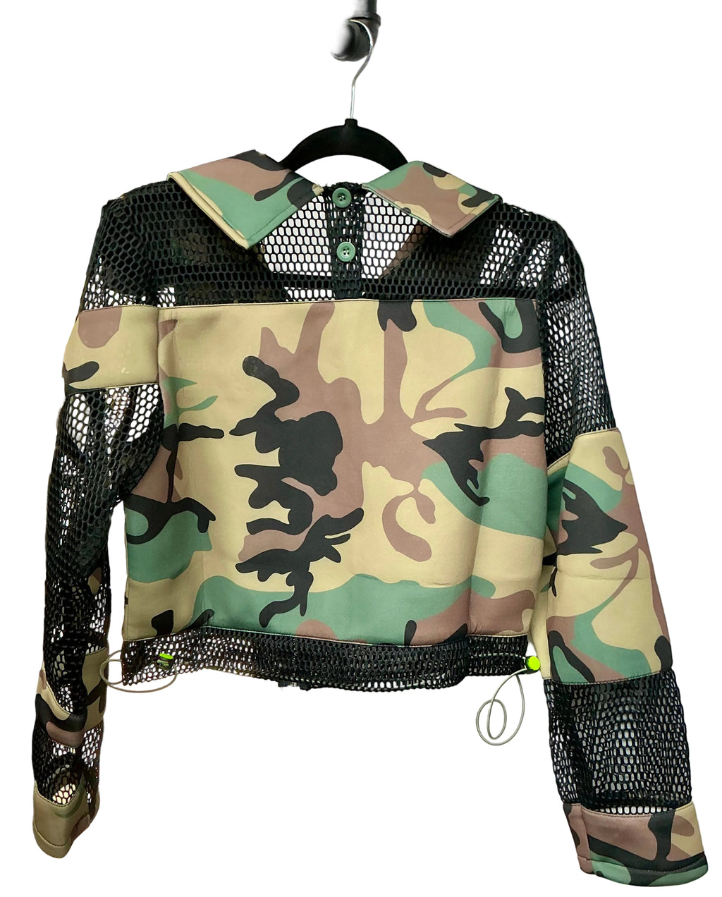 Back side of Camouflage jacket with black mesh panels on a hanger against a white background