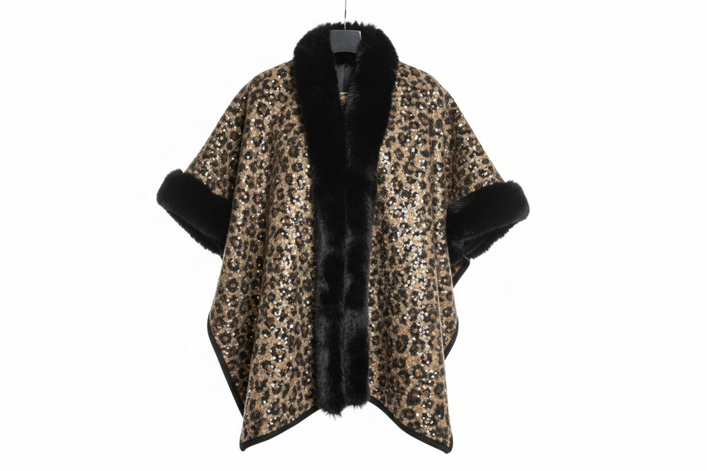 Leopard print coat with black fur trim on a hanger.