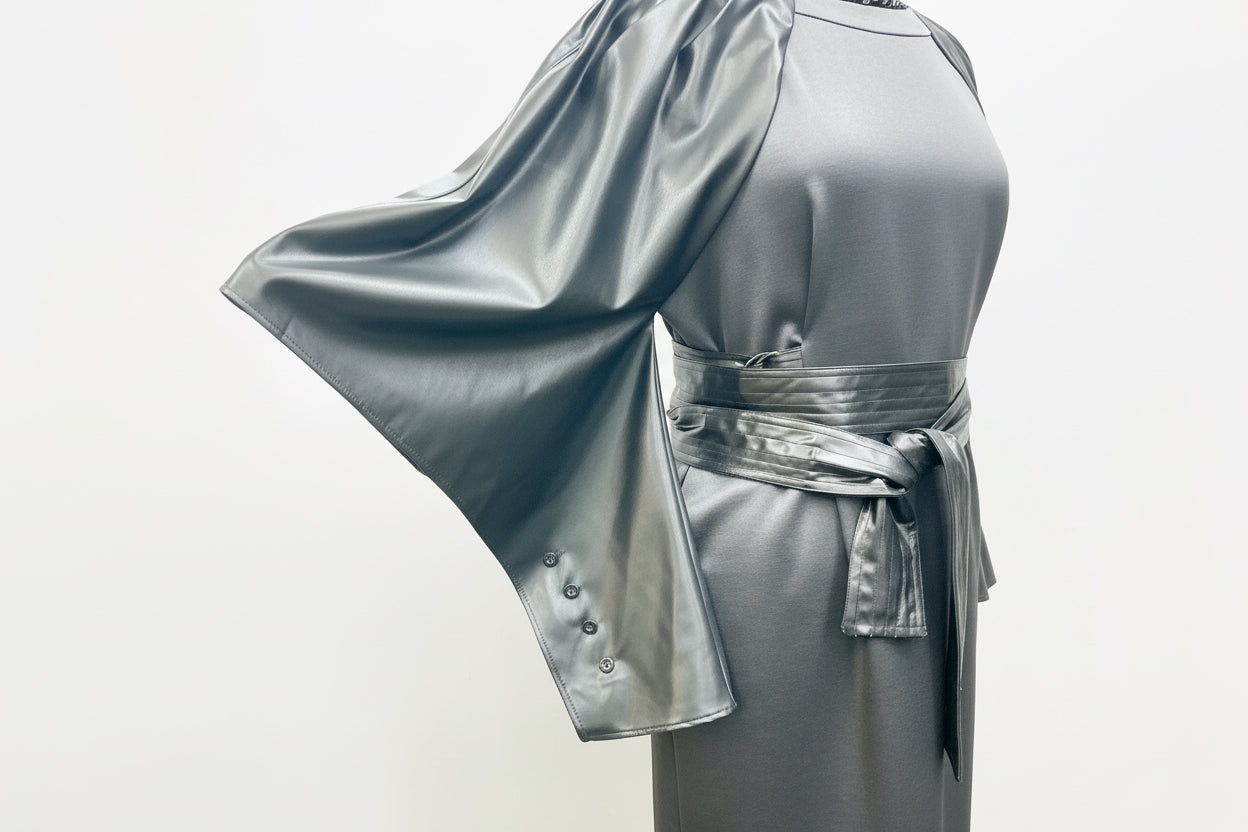 Black dress, vegan leather cape sleeve with buttons, vegan leather belt tied