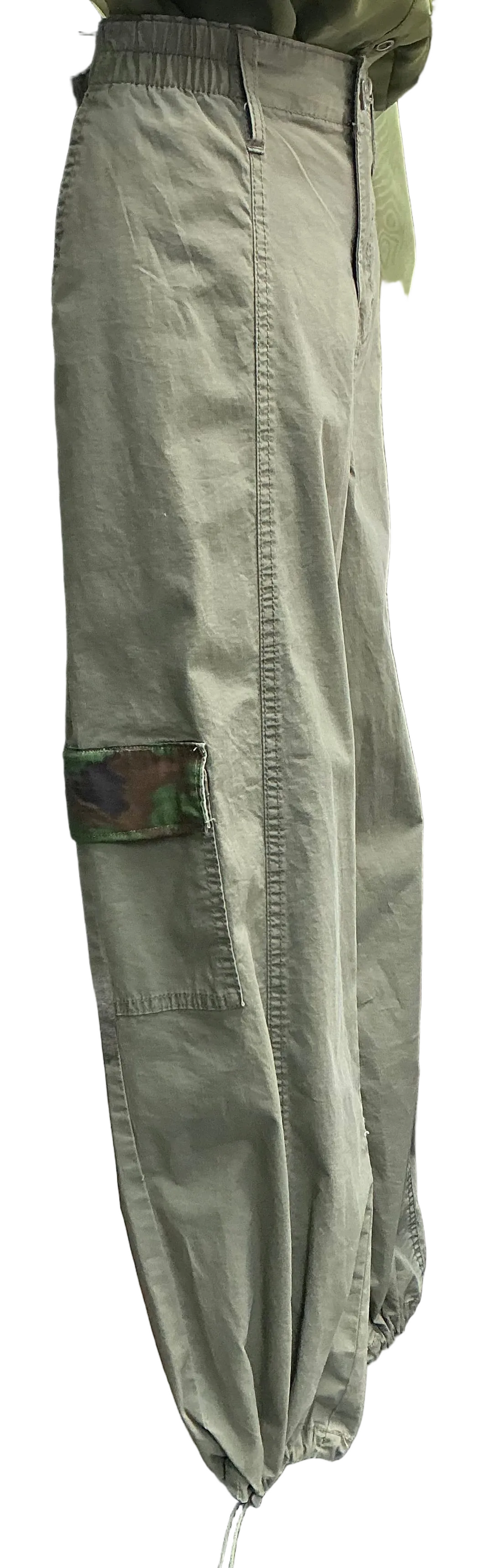 Side view of Green military-style parachute pants with camo accented pocket on lower leg